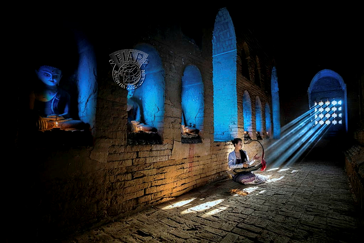 104_Si Thu Ye Myint_Harpist In Sunlight.jpg